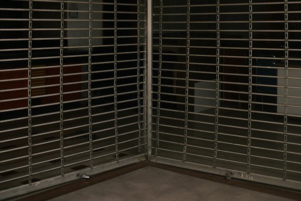 A store&rsquo;s metal shutters closed for the night