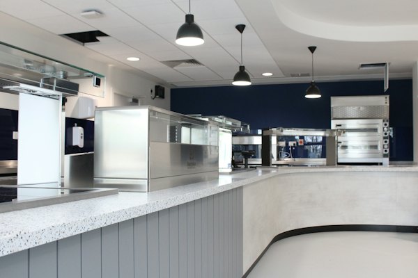 A clean quick-service counter and kitchen