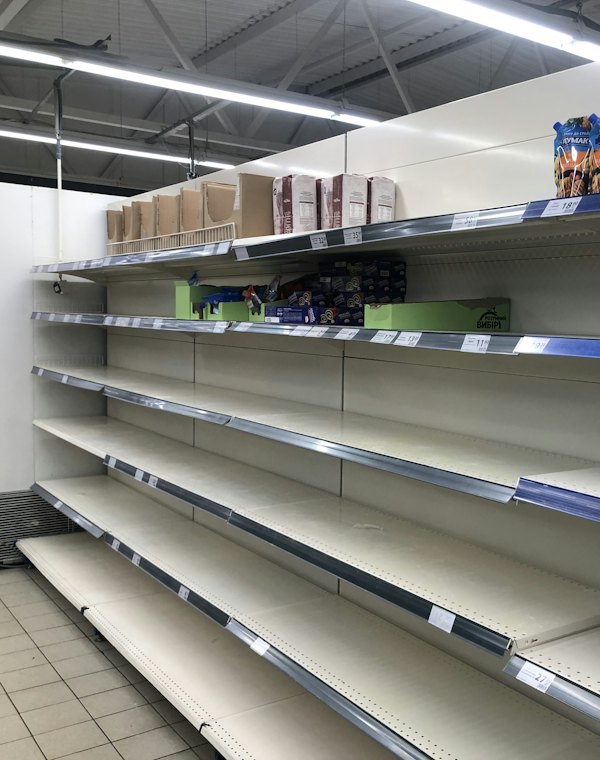 Airport, the worst store: the same kind of aisle with most shelves empty
